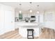 Eat-in kitchen featuring white cabinets, granite countertops, and stainless-steel appliances at 3025 Creek Moss Ave, Wake Forest, NC 27587
