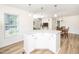 Kitchen island with breakfast bar, granite countertops and open floor plan at 3025 Creek Moss Ave, Wake Forest, NC 27587