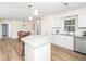 Open kitchen and dining room area, featuring granite counters and stainless steel appliances at 3025 Creek Moss Ave, Wake Forest, NC 27587