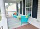 Cozy porch seating area with colorful furniture and a decorative rug at 3025 Creek Moss Ave, Wake Forest, NC 27587