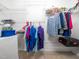 Organized walk-in closet with shelving and hanging rods for ample storage space at 3025 Creek Moss Ave, Wake Forest, NC 27587