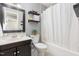 Bathroom with vanity and shower/tub combo at 305 Burkwood Ln, Raleigh, NC 27609