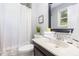 Bathroom with vanity and shower/tub combo at 305 Burkwood Ln, Raleigh, NC 27609