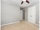 This bedroom features neutral carpet, a ceiling fan, and a built-in closet at 305 Burkwood Ln, Raleigh, NC 27609