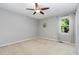 Bedroom with neutral walls and carpet, fan, and natural light at 305 Burkwood Ln, Raleigh, NC 27609