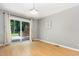 Bright dining area featuring hardwood floors and sliding glass doors to a deck at 305 Burkwood Ln, Raleigh, NC 27609