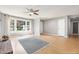Sunlit living room featuring hardwood floors and large windows at 305 Burkwood Ln, Raleigh, NC 27609