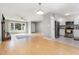 Open concept living space featuring hardwood floors, natural light, and kitchen access at 305 Burkwood Ln, Raleigh, NC 27609