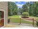 Inviting backyard view from the wooden deck, showcasing the expansive lawn and detached garage at 310 Cross Lake, Fuquay Varina, NC 27526