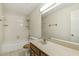 Neutral bathroom with a vanity, tile floors, and shower-tub combo at 310 Cross Lake, Fuquay Varina, NC 27526