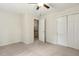 Bedroom featuring plush carpet, ceiling fan, and closet for storage at 310 Cross Lake, Fuquay Varina, NC 27526