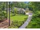 Charming two-story home with a well-manicured lawn, mature trees, and inviting curb appeal at 310 Cross Lake, Fuquay Varina, NC 27526