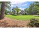 Beautiful two-story home with a lush green lawn, mature trees, and well-maintained landscaping at 310 Cross Lake, Fuquay Varina, NC 27526