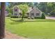 Charming home with a well-kept lawn and mature trees at 310 Cross Lake, Fuquay Varina, NC 27526