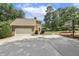 Exterior view of house with two car garage, long driveway and basketball hoop at 310 Cross Lake, Fuquay Varina, NC 27526
