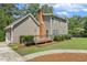 Exterior angle of a house with backyard deck and lush green landscaping surrounding the property at 310 Cross Lake, Fuquay Varina, NC 27526