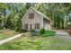 Well-maintained exterior features beautiful landscaping and a garage addition in a lush, green setting at 310 Cross Lake, Fuquay Varina, NC 27526