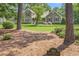 A neatly manicured front yard with a sign displaying the house number: 310 Cross Lake Drive at 310 Cross Lake, Fuquay Varina, NC 27526