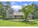 Inviting home featuring a charming front porch, lush landscaping, and a well-manicured lawn at 310 Cross Lake, Fuquay Varina, NC 27526