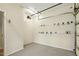 The garage has a gray floor and hooks for tool storage at 310 Cross Lake, Fuquay Varina, NC 27526
