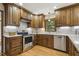 Updated kitchen with modern appliances, custom cabinets, and recessed lighting at 310 Cross Lake, Fuquay Varina, NC 27526
