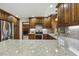 Well-equipped kitchen showcasing granite countertops and updated stainless steel appliances at 310 Cross Lake, Fuquay Varina, NC 27526