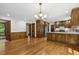 Open-concept kitchen with custom wood cabinetry and stainless steel appliances at 310 Cross Lake, Fuquay Varina, NC 27526