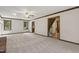 Expansive living room with fireplace, hardwood trim, and view of the staircase at 310 Cross Lake, Fuquay Varina, NC 27526