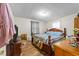 Inviting bedroom with hardwood floors, warm-toned wood furniture, and soft, textured bedding at 313 Colleton Rd, Raleigh, NC 27610