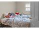 Simple bedroom with a cozy bed, soft lighting, and a relaxing atmosphere at 313 Colleton Rd, Raleigh, NC 27610