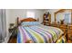 Spacious bedroom featuring hardwood floors, a wooden bed frame, and ample storage space with a dresser and mirror at 313 Colleton Rd, Raleigh, NC 27610