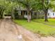 Charming home featuring a well-manicured front lawn and a driveway, creating a welcoming curb appeal at 313 Colleton Rd, Raleigh, NC 27610
