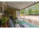 Outdoor patio area with seating and green accents, perfect for relaxing and entertaining at 313 Colleton Rd, Raleigh, NC 27610
