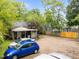 Back view of home with a spacious parking area and a covered patio, perfect for outdoor gatherings and convenience at 313 Colleton Rd, Raleigh, NC 27610