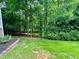 Expansive backyard with lush greenery, offering privacy and ample space for outdoor activities at 327 Beavertail Rd, Henderson, NC 27537
