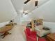 Spacious upper level bonus room features seating area, table, and ample storage at 327 Beavertail Rd, Henderson, NC 27537