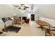 Large bonus room featuring ceiling fans, storage, and ample space for exercise or recreational activities at 327 Beavertail Rd, Henderson, NC 27537