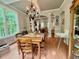 Hardwood floors, views to living room through archway in this staged dining room at 327 Beavertail Rd, Henderson, NC 27537