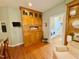 Kitchen with wooden cabinets adjacent to doorway leading to a laundry room at 327 Beavertail Rd, Henderson, NC 27537