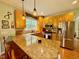 Kitchen featuring stainless steel appliances, granite countertops, and a breakfast bar at 327 Beavertail Rd, Henderson, NC 27537