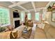 Bright living room with coffered ceiling, fireplace, and large windows at 327 Beavertail Rd, Henderson, NC 27537