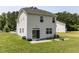 Backyard view of home with open lawn and a patio that's great for relaxing or entertaining at 3507 Portico Ln, Durham, NC 27703
