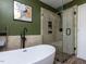 This is a modern bathroom with a freestanding tub and glass shower at 3507 Portico Ln, Durham, NC 27703