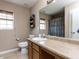 A functional bathroom with a single sink, window, and bath/shower combo at 3507 Portico Ln, Durham, NC 27703