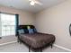 This is a cozy bedroom featuring a ceiling fan and natural light at 3507 Portico Ln, Durham, NC 27703
