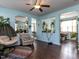Inviting living room with hardwood floors, a comfortable chair, a rug, and indoor plants at 3507 Portico Ln, Durham, NC 27703