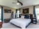 Primary bedroom with carpet flooring, trey ceiling, ceiling fan, and an abundance of natural light at 3507 Portico Ln, Durham, NC 27703