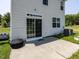 Cozy patio featuring a sliding glass door and a black outdoor chair on a well-maintained lawn at 3507 Portico Ln, Durham, NC 27703
