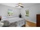 Well-lit bedroom with two windows and light-colored walls for a spacious feel at 3515 Luna Ln, Durham, NC 27705