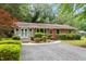 Brick exterior with well-maintained landscaping and a welcoming entrance at 3515 Luna Ln, Durham, NC 27705